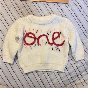 White Sweater with Colorful 'One' Design